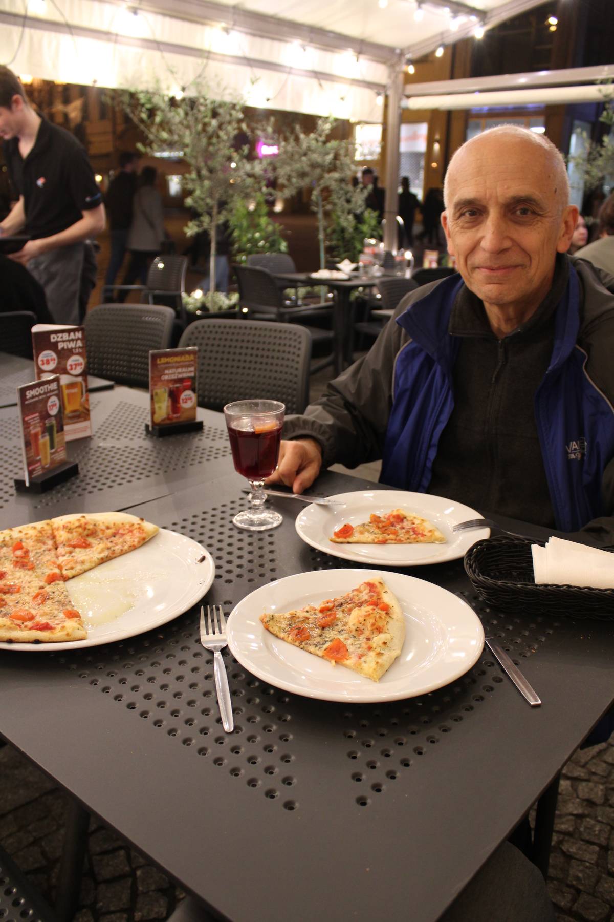 My father eating pizza at dominoes