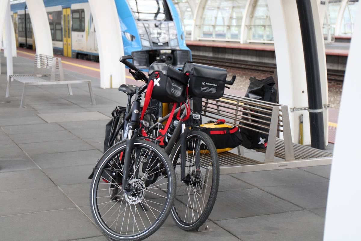 Our bikes leaning against a train station bench