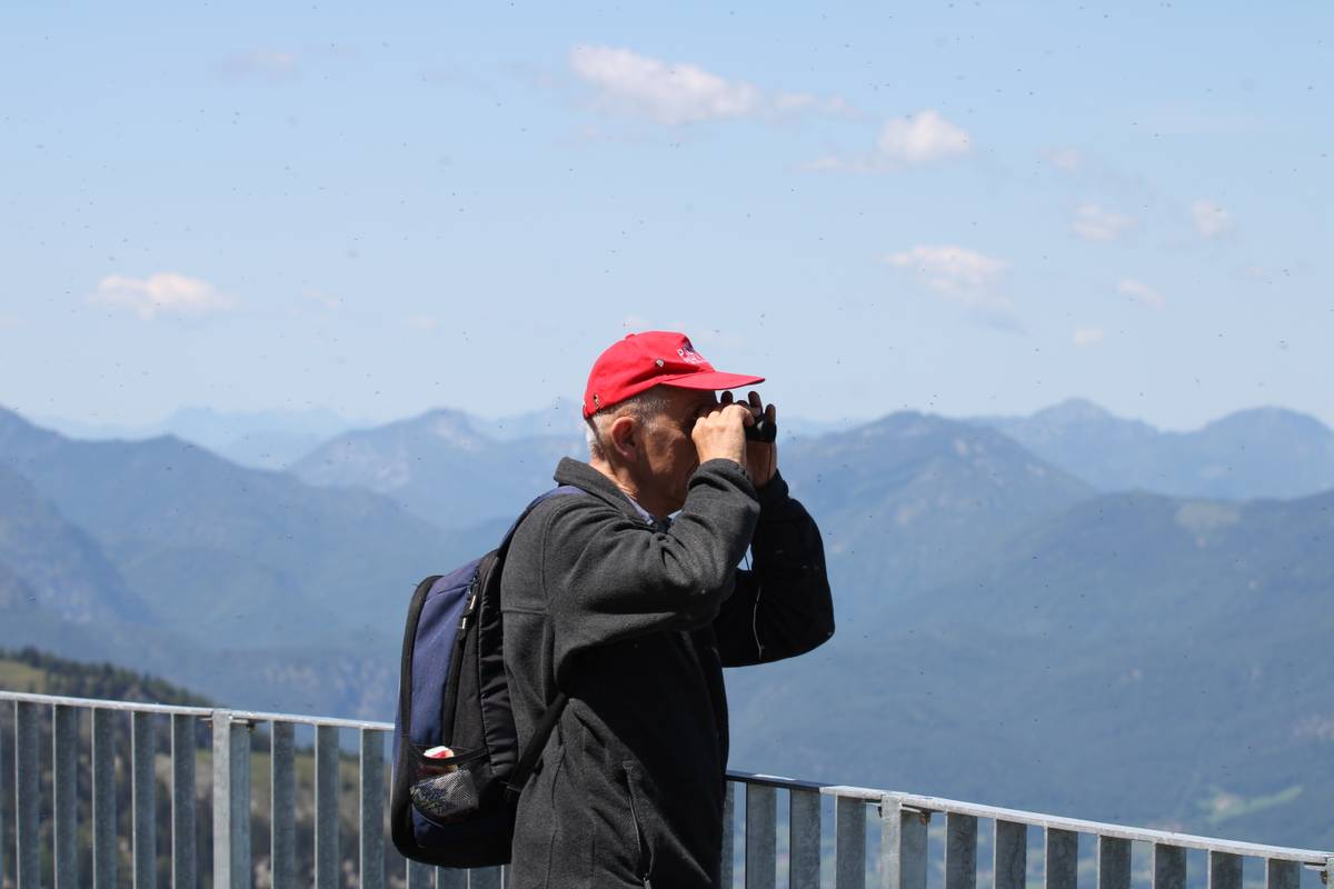 My dad looks through a pair of pocket binoculars