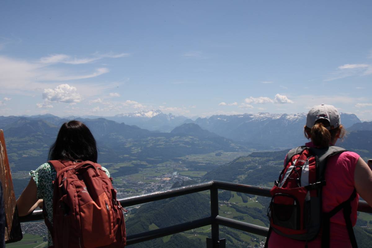 The view is visible through two other onlookers