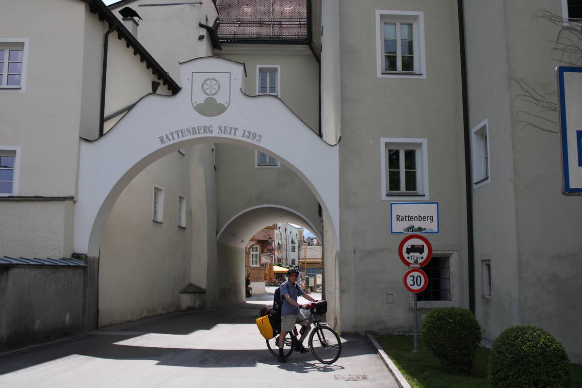 My dad poses with his packed bike outside the gate for Rattenberg