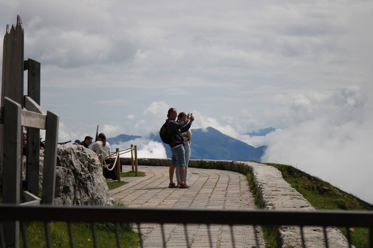 A man takes a photo with his phone